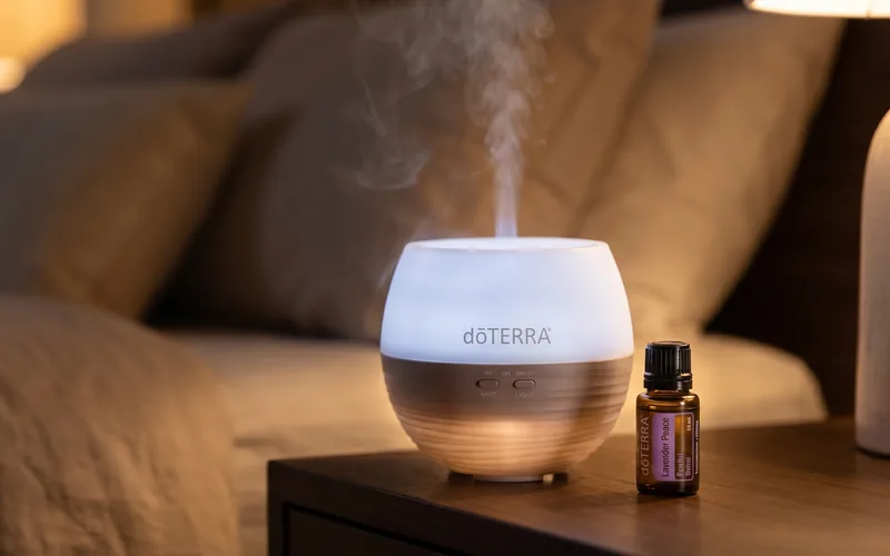 dōTERRA Petal Diffuser 2.0 on a bedside table at night